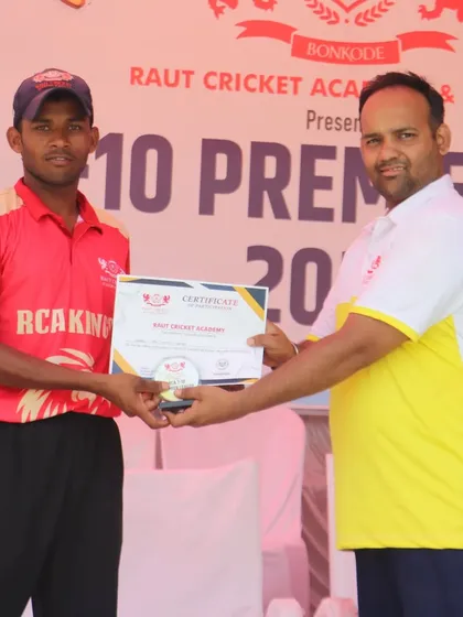 A player from the RCA Kings is presented with his certificate, marking a successful end to the T-10 league.