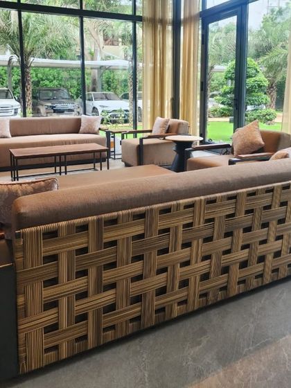 A closer look at the custom sofa with intricate weaving on the back. This piece was supplied for a hotel lobby, showcasing our ability to provide unique, high-quality furniture for commercial clients.