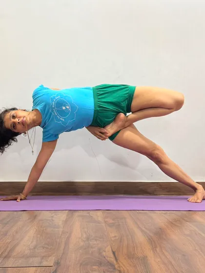 This is a variation of Parivrtta Parsvakonasana (Revolved Side Angle Pose). The pose combines a deep twist with a standing posture, detoxifying the abdominal organs while strengthening the legs.