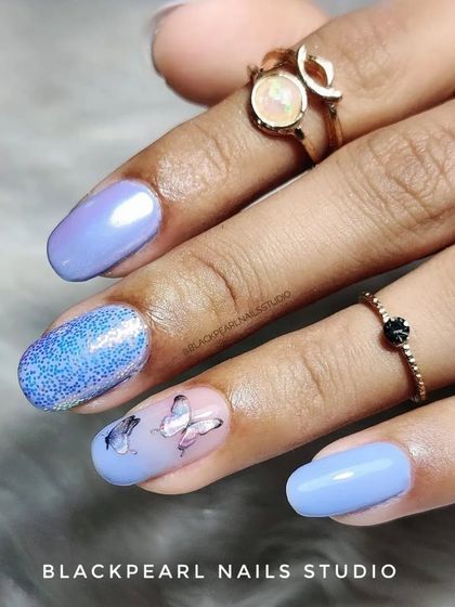 A close-up of the butterfly sticker art, showing how these details can add a charming and personalized touch to any manicure.