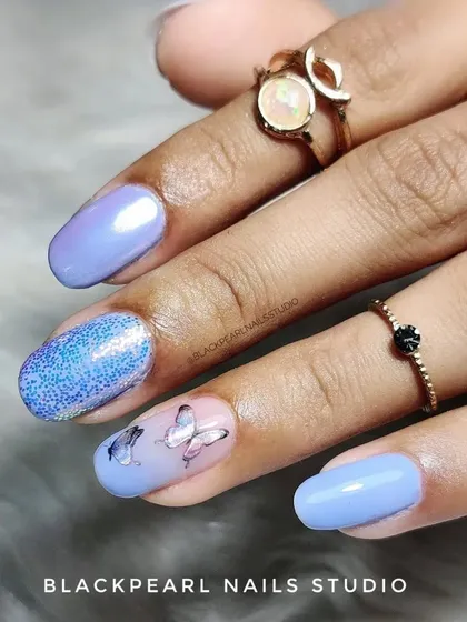 A close-up of the butterfly sticker art, showing how these details can add a charming and personalized touch to any manicure.