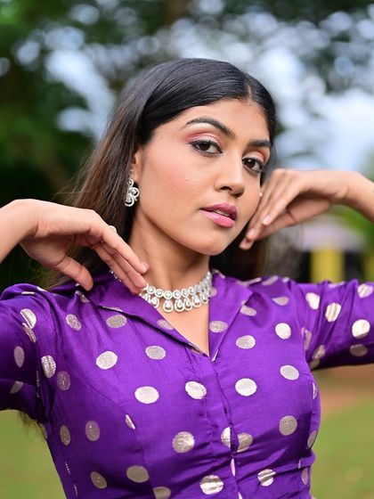 A close-up of the makeup, showing the soft winged eyeliner and pink-toned eyeshadow. It's a modern and trendy soft glam look.