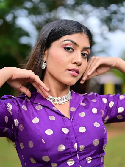 A close-up of the makeup, showing the soft winged eyeliner and pink-toned eyeshadow. It's a modern and trendy soft glam look.