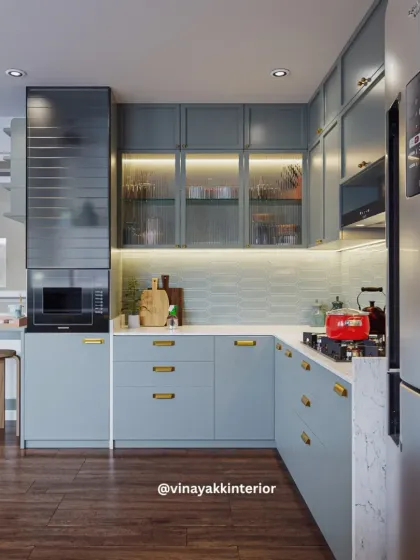 A modern kitchen should be as beautiful as it is functional. For this project, I chose calming powder-blue cabinets with sleek gold handles for a contemporary look. Features like fluted glass shutters and under-cabinet lighting add both style and practicality, making everyday cooking a pleasure.