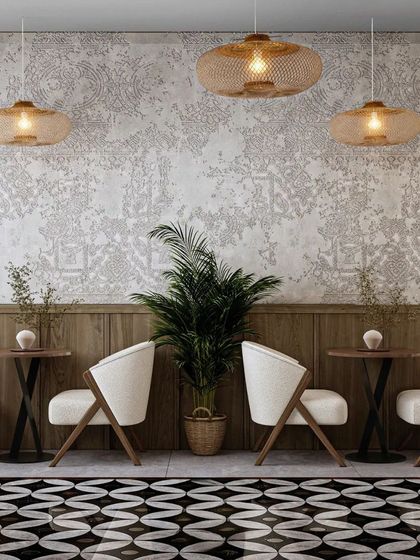 A minimalist seating arrangement with clean lines and natural wood tones. The patterned wallpaper and woven light fixtures add subtle texture and visual interest.