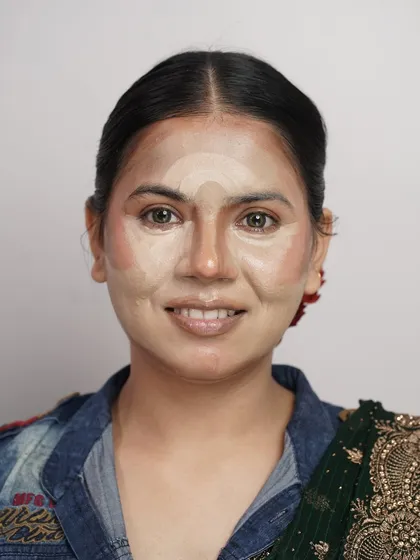 This image shows the underpainting process for an editorial glam look. This technique of applying contour and color before foundation is a secret to achieving a natural, sculpted finish.