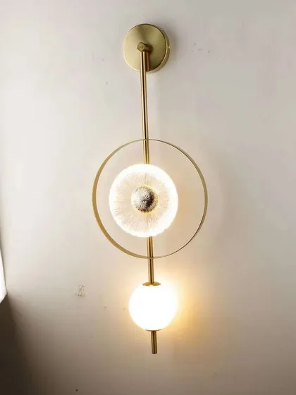 A variation of our geometric wall sconce, shown here in a vertical orientation. It's a versatile piece for modern interiors.