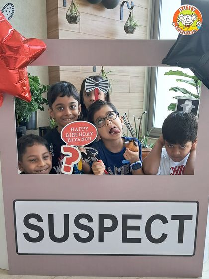 A group of suspects caught in the act! Kids love the chance to be silly and play the part of the mystery characters in our interactive photo booth setup.