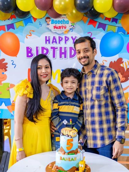 A lovely family photo from Damian's 5th birthday, celebrating with his one-of-a-kind "Stinky & Dirty" cake.