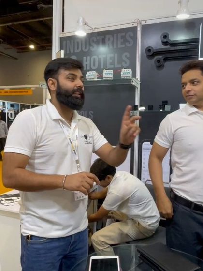 A shot from an expo, where I'm deep in conversation explaining the benefits of my smart home systems to an engaged audience.