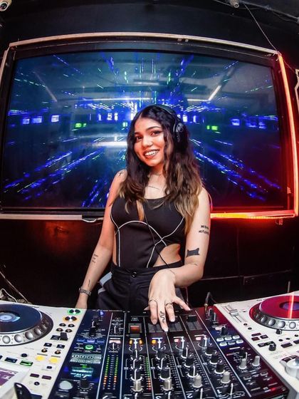 A happy moment captured during a lively set. I love seeing the crowd respond to the music I play.