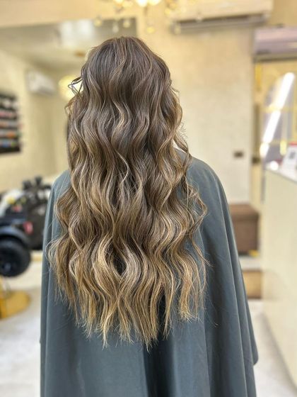Another shot of the olive ashy brown balayage, showcasing the seamless blend and cool, ashy tones.