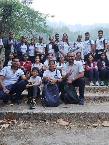 The whole group together on the steps during our yoga trek. These shared experiences create lasting memories and friendships.
