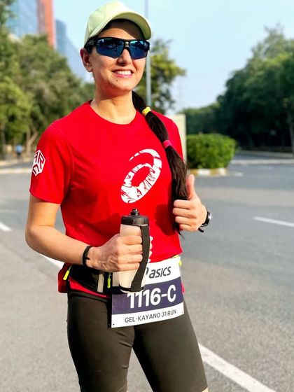 A runner looking strong and hydrated during a training run. We teach our members how to manage their energy and hydration for optimal performance.