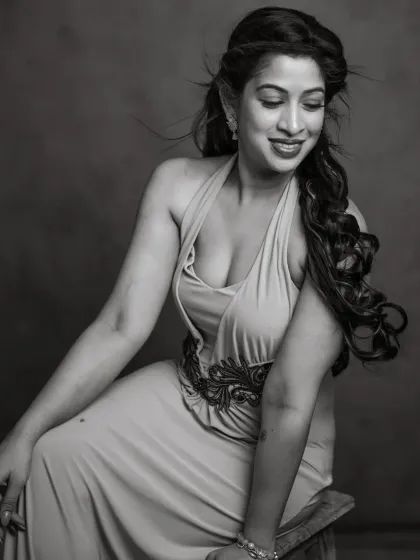 A joyful and candid moment captured in timeless black and white. Pallavi's smile and the movement in her hair give this portrait a feeling of life and energy. It’s a celebration of her spirit, rendered in classic monochrome.