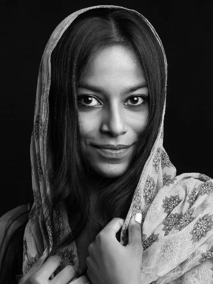 A captivating black and white portrait of a dusky model. I focus on creating powerful images that celebrate diverse beauty.