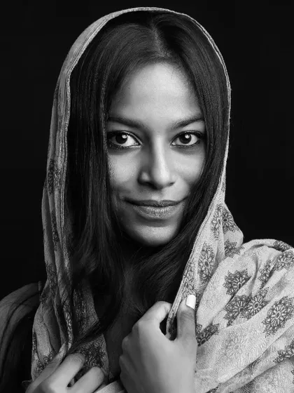 A captivating black and white portrait of a dusky model. I focus on creating powerful images that celebrate diverse beauty.