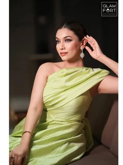 A relaxed and elegant pose. The lighting catches the subtle contour and highlight, showing the importance of sculpting the face for photographic looks.