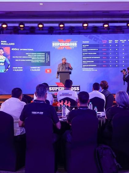 The live auction in progress at the ISRL auction, with player stats displayed on the main screen. Our custom software and digital content creation were key to the event's success.