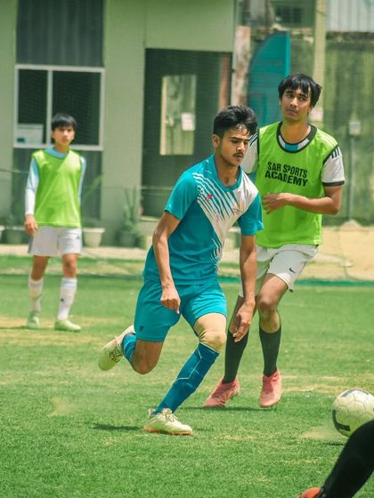 An older player runs with the ball during a training session at the Pride Cup.