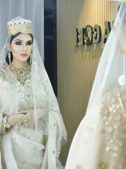 An elegant Muslim bridal look, featuring a white and gold outfit with dramatic eye makeup. Our courses cover diverse cultural traditions to prepare our students for a wide range of clients.