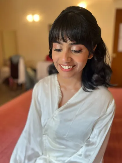 Shruti's smile says it all. Her soft pink lips and glowing skin were the perfect combination for her classic wedding look.