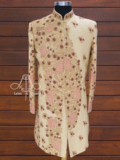 A full view of the custom sherwani with its unique, artistic embroidery. I designed this piece to be a wearable work of art, ensuring you stand out.