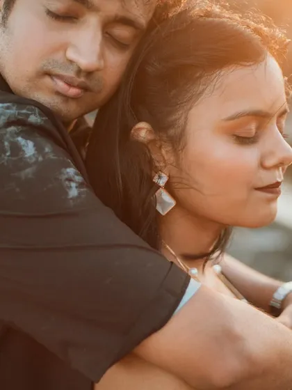 A tender embrace captured during a golden hour pre-wedding shoot in Goa. The warm light and close connection make this a timeless and romantic portrait.