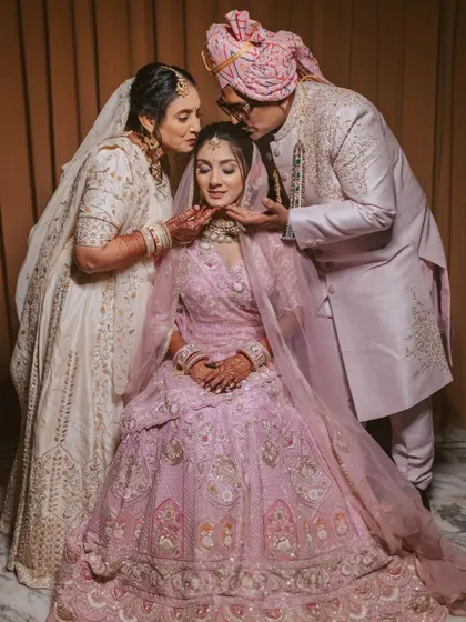 A tender moment of love and blessings from the parents. These are the candid family portraits we cherish, capturing the deep emotional bonds that are at the core of every wedding celebration.