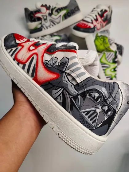 A close-up of the Darth Vader shoe. The design incorporates his iconic helmet and a fiery red lightsaber effect into the shoe's natural wave pattern.