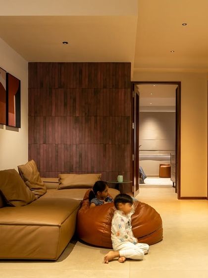 We design spaces for real life. Here, the informal family lounge with a low-profile sectional sofa and beanbags is a comfortable and playful area for the children.