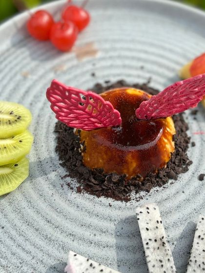 Our Filter Coffee Dessert, a vanilla bean panna cotta infused with coffee and served with seasonal fruits.