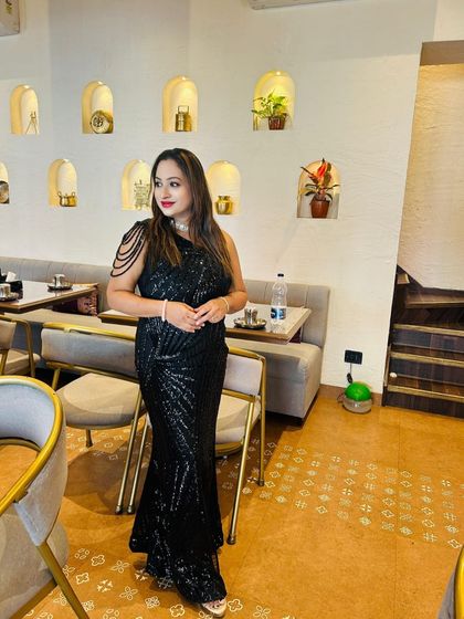 A gorgeous client looking stunning in a black sequined bodycon dress. The one-shoulder detail with pearl strings adds a touch of glamour.