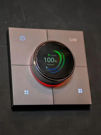 A close-up of my rotary knob switch, a highlight at the Smart Home Expo. This device combines a digital display with a physical dial, showing brightness levels and offering a modern yet intuitive control experience.