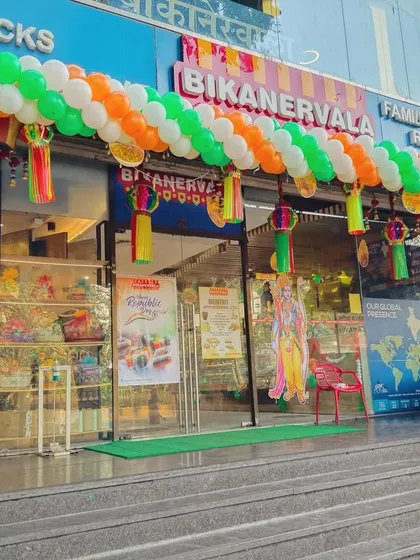 This is one of several angles of the Republic Day balloon arch decoration at Bikanervala. The full arch creates an inviting and patriotic entrance for the restaurant's customers.