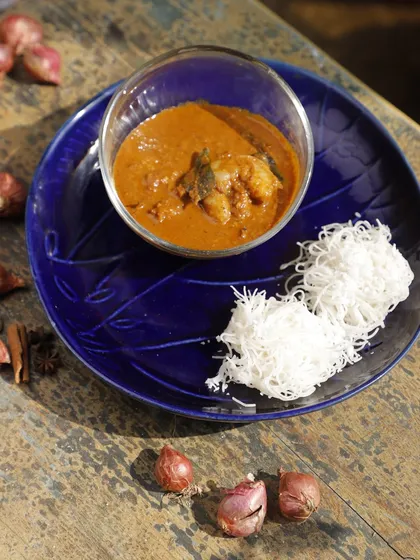 Our Ulli Theeyal features caramelized roasted coconut, tamarind, and slow-cooked shallots. With its deep, smoky flavours and crackling tanginess, this dense and intriguing dish is a bold, complex experience.