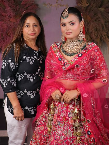 From learners to artists. Our students master the art of bridal makeup, creating breathtaking looks like this one with a vibrant pink lehenga and heavy kundan jewelry.