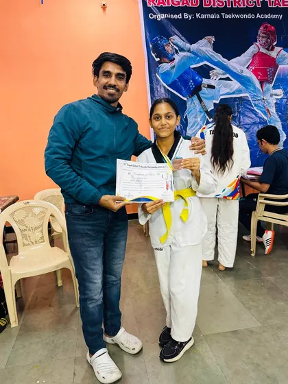 With my student Vedika after her win at the Raigad District Taekwondo competition.