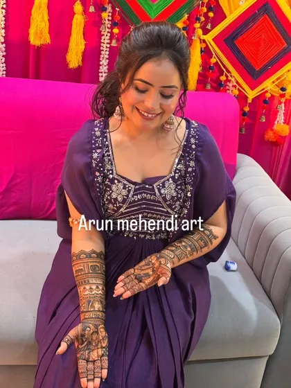 Another view of the happy bride and her custom mehendi, showing how the design looks from the side.