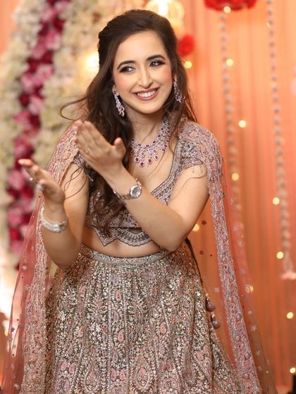 A candid shot full of joy and laughter. The makeup is designed to be long-lasting and picture-perfect, even during the most energetic dance performances.