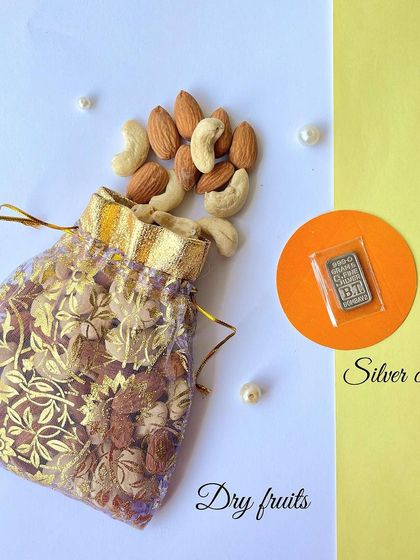 We also include a potli of assorted dry fruits and a small silver coin for good luck in our Diwali hamper.
