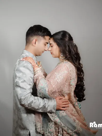 A deeply romantic and intimate close-up portrait. The soft lighting and the couple's foreheads touching create a powerful image that speaks of trust, love, and a shared future.
