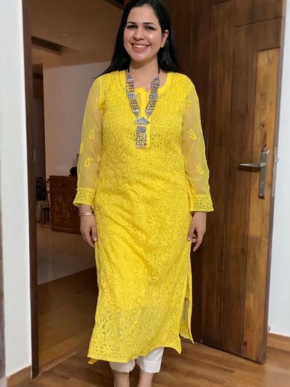 A bright yellow Chikankari kurti is perfect for adding a pop of color to your wardrobe. Here, I've paired it with a heavy silver necklace for a bold, festive look.