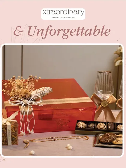 This unforgettable red hamper includes wine glasses and a selection of our finest truffles and cookies.