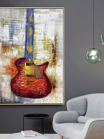 For the music lover who appreciates fine art, this hand-painted abstract guitar is a perfect choice. The textured background and expressive colors give the classic instrument a modern, artistic twist.