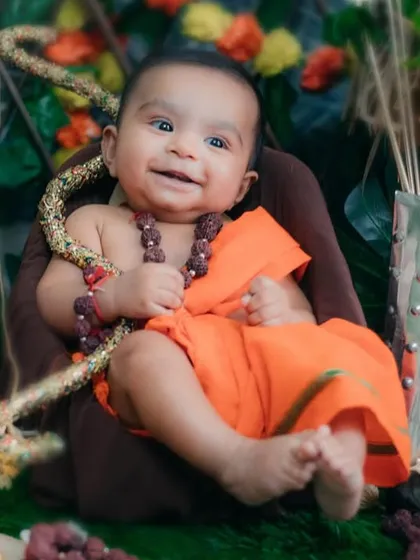 A blessed smile from our little Ram. His joy and innocence perfectly capture the divine spirit of the festival.