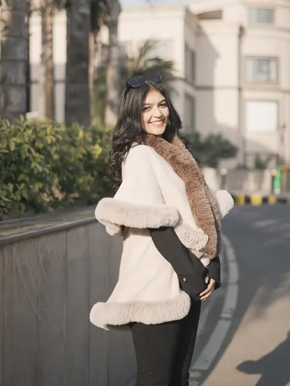 Another angle of the fur cape. It's a luxurious piece that can make any simple outfit look sophisticated.