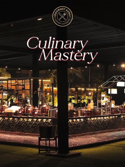 A sprawling buffet setup at night, showcasing our "Culinary Mastery" with an impressive array of dishes and elegant decor.