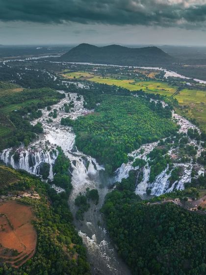 An incredible aerial view of the twin waterfalls, Gagana Chukki and Bhara Chukki, which together form Shivanasamudra. We visit this spot post-monsoon for the best views.