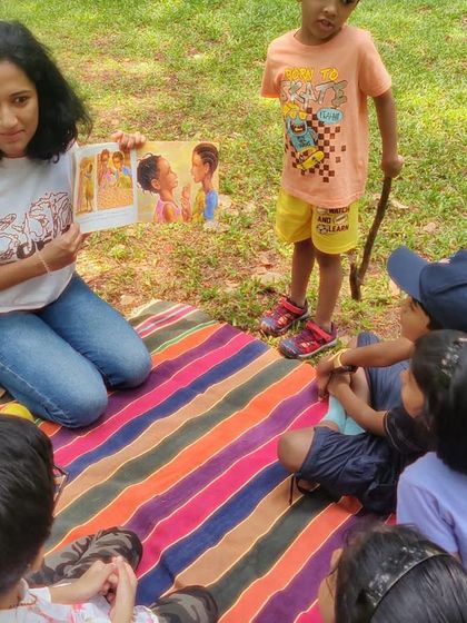 A fantastic series from our reading of 'Handa's Surprise'. My animated storytelling style is on full display, as are the delighted and curious faces of the children.